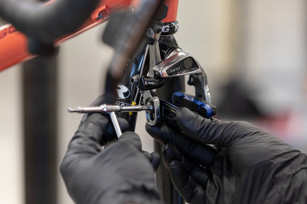 how to widen brake pads on bike