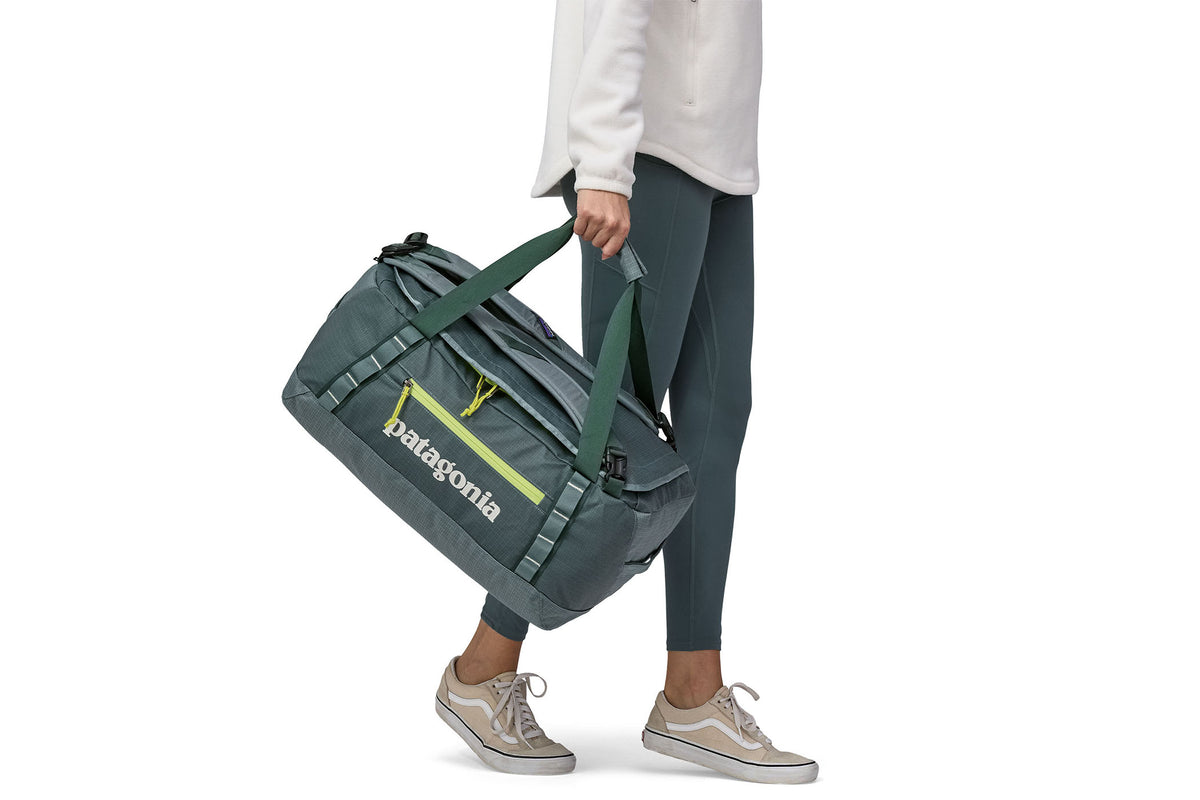 green patagonia duffel Black Hole 55L resistant 100% recycled polyester ripstop with a matte Patagonia 40L Black Hole Duffel
